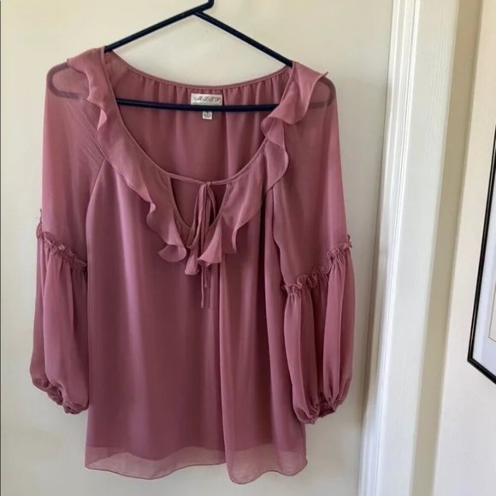 Sheer ruffled pink blouse
